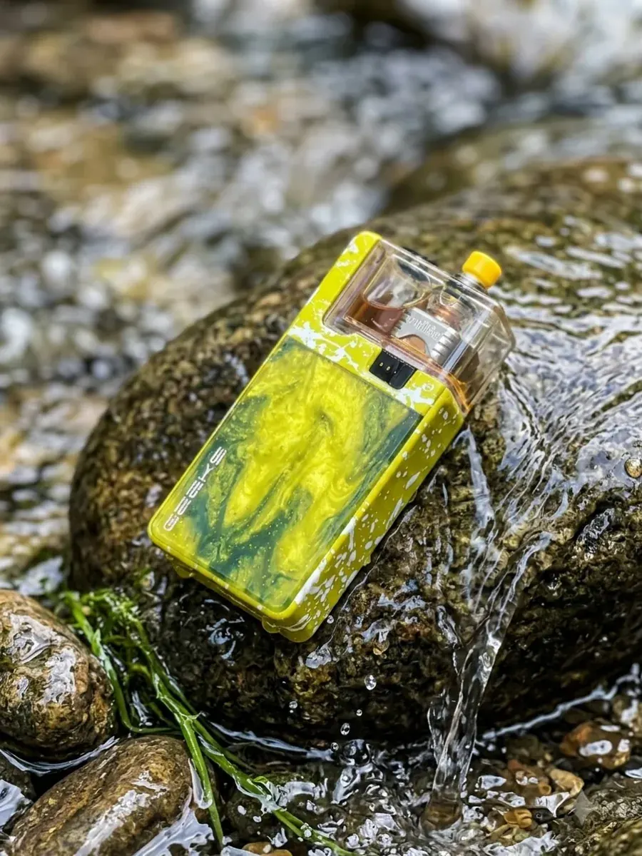 Yellow LVE device photographed beside running water