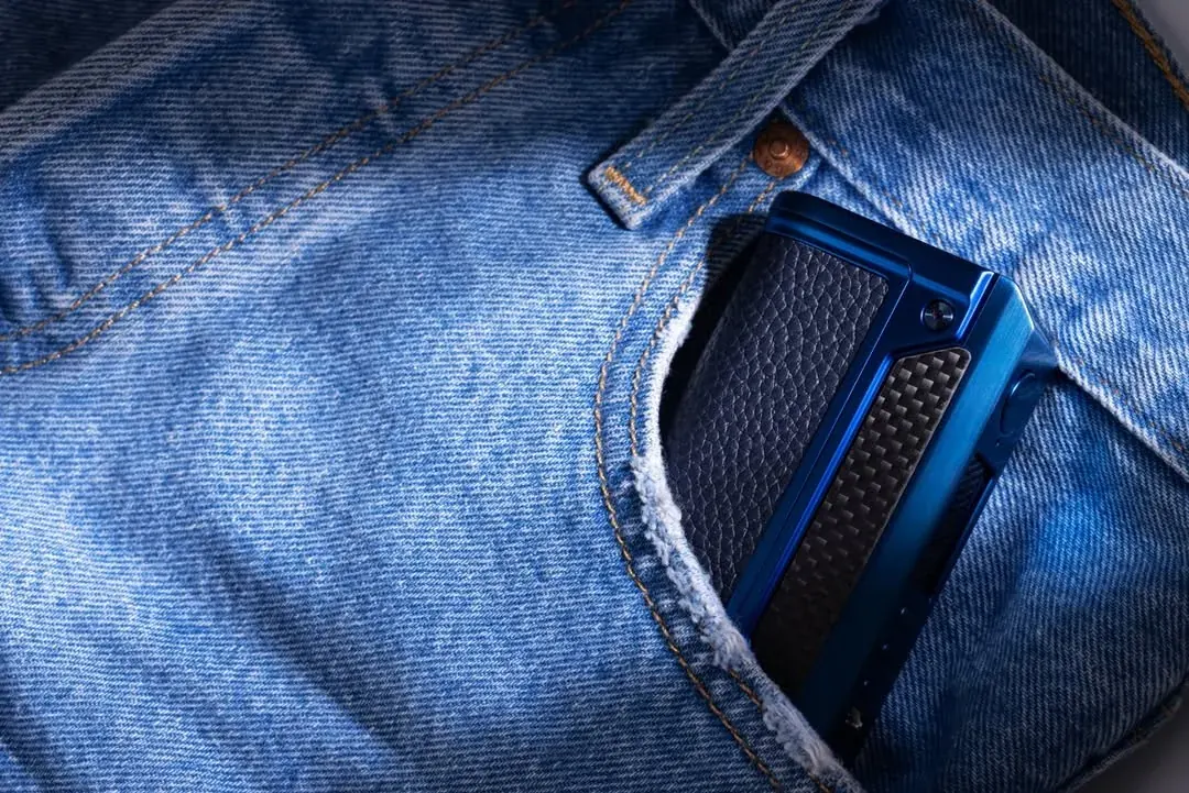 Blue LVE device carried in a denim pocket