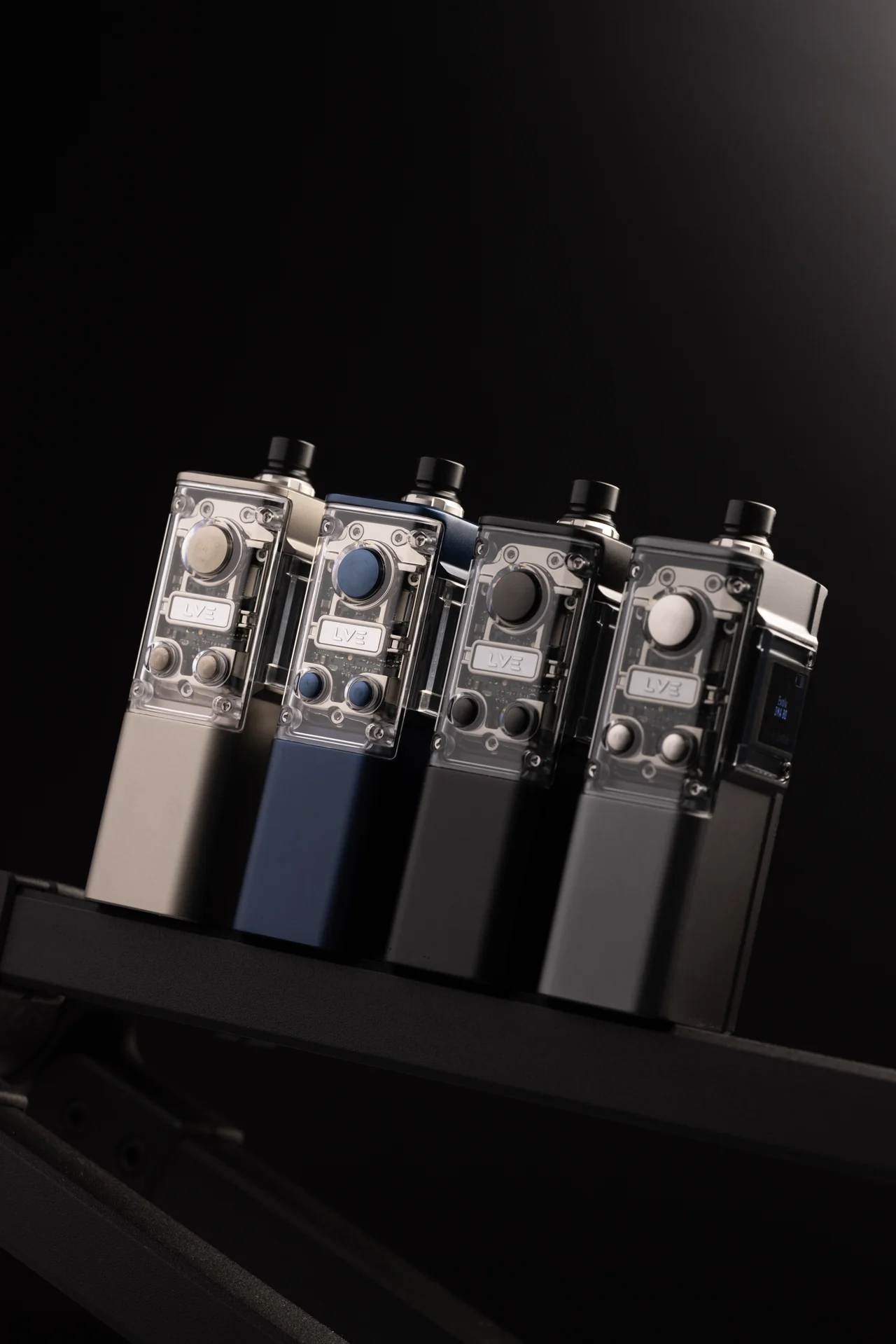 Four BOSON DNA80C devices shown together in silver, navy, black, and space grey finishes