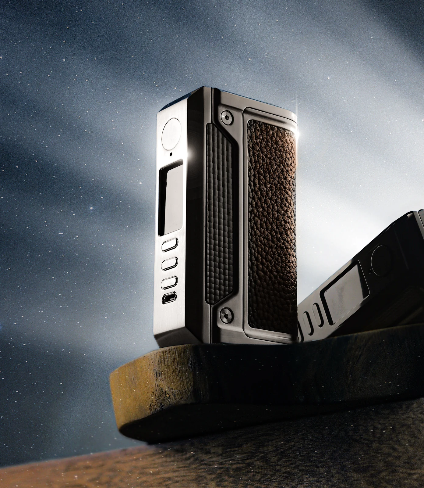 Silver THERION II DNA250C shown beside a sculptural wooden base
